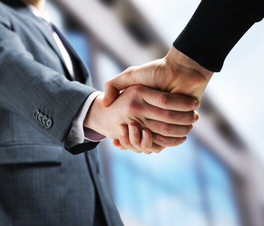 depositphotos_10654338-stock-photo-two-businessmen-shaking-hands